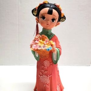 Asian porcelain flower girl doll.